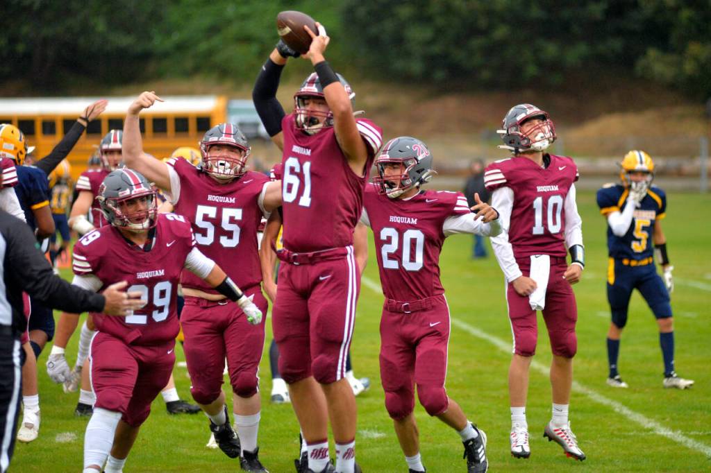 RYAN SPARKS | THE DAILY WORLD Hoquiam lineman James Monroe (61) celebrates with his teammates after recovering an Aberdeen fumble on the first play from scrimmage during the Bobcats 40-0 victory on Friday in Hoquiam.