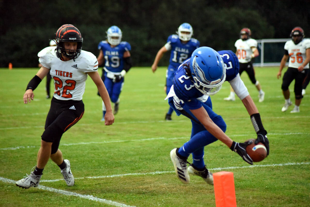 PHOTO BY SUE MICHALAK BUDSBERG Elma receiver Ethan Camus (23) dives into the end zone for a two-point conversion in the Eagles 20-7 win over Centralia on Friday at Davis Field in Elma.