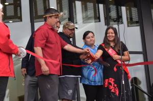 Matthew N. Wells | The Daily World 
Quinault Indian Nation President Guy Capoeman (left) cuts the Quinault Wellness Center ceremonial ribbon with other members of the Quinault Tribe on Aug. 31, 2022, in Aberdeen. The treatment center is excepted to have its grand opening on Oct. 3.
