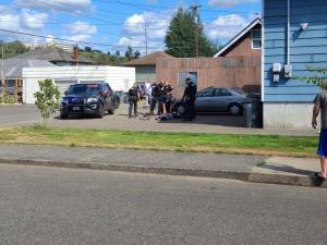 Aberdeen and Hoquiam police officers surround alleged shooting suspect Ricky Lee Lopez, 31, during his arrest in the alley situated between the 2900 blocks of Simpson and Aberdeen avenues. (Courtesy Photo)