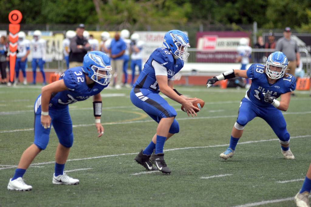 DAILY WORLD FILE PHOTO Isaac Phillips (32), Carter Studer (12) and Austin Salazar (16) and the rest of the Elma Eagles will take on Cascade Christian at 7 p.m. on Friday, Sept. 9, 2022, at Davis Field in Elma.