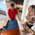 Matthew N. Wells | The Daily World
Lee and Dani Bacon show <em>The Daily World</em> old blueprints on Friday, Sept. 2, 2022, in a remodeled upstairs space inside their two-story building at the intersection of West Wishkah and South K streets. The couple bought the 92-year old building in 2021. Theyve been working to restore the historic building ever since.