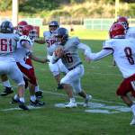 RYAN SPARKS | THE DAILY WORLD Hoquiam running back Jake Templer (16) runs through the Fort Vancouver defense during the Grizzlies 49-28 victory on Thursday in Hoquiam. Templer rushed for 110 yards and a touchdown.