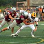 RYAN SPARKS | THE DAILY WORLD Montesano defenders Gabe Bodwell, middle, and Ethan Blundred, left, sack Aberdeen quarterback Kale Goings during Montes 29-0 win on Friday at Jack Rottle Field in Montesano.