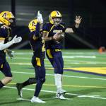 RYAN SPARKS | THE DAILY WORLD Injured Aberdeen quarterback Kale Goings, right, celebrates with his teammates after taking a knee to secure the Bobcats 25-6 win over Centralia on Friday in Aberdeen.