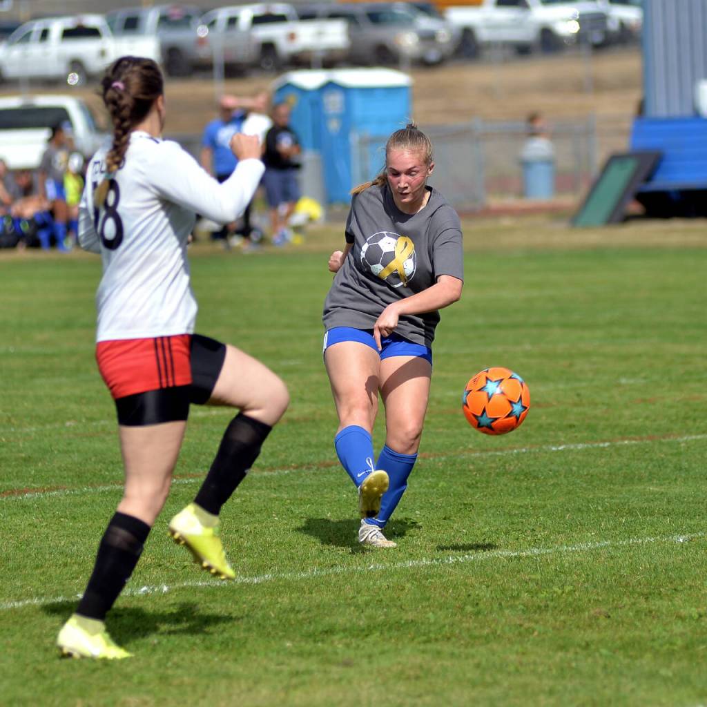 RYAN SPARKS | THE DAILY WORLD Elma midfielder Miley Seaberg, right, shoots during Elmas 10-0 win on Saturday, Sept. 17, 2022 at Davis Field in Elma. Seaberg scored three goals and had two assists in the victory.