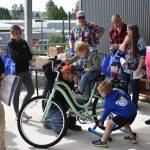Families patiently waited in line for their chance to use the smoothie-making bicycle at the Summit Pacific Peak Health Wellness Fair on Saturday, Sept. 17, 2022, in Elma. The custom-made bicycle, which will be present at every future Summit Pacific event, was obtained via a $1,000 grant. (Allen Leister | The Daily World)