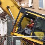 (Matthew N. Wells | The Daily World)
Jason Mellick, operator with Ascendent Demolition, appears to enjoy himself on Tuesday morning, Sept. 27, as he carefully and deliberately tears down sections of the South H Street side of the two-story Grays Harbor Transportation Authority building. The buildings official address is 300 E. Wishkah St., according to the Grays Harbor Tax Assessors website.