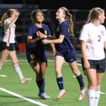RYAN SPARKS | THE DAILY WORLD Aberdeen co-captain Aman Cheema (5) celebrates with forward Annie Troeh after Troeh scored in the second half of the Bobcats 3-0 victory on Thursday, Sept. 29, 2022 at Stewart Field in Aberdeen.