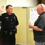 Matthew N. Wells | The Daily World 
Aberdeen Police Department Chief Dale Green swears in with Aberdeen Mayor Pete Schave on Wednesday night, Sept. 28, at the Aberdeen City Council meeting in the council chambers. Green, who was interim chief since now-retired Chief Steve Shumate retired June 30, will start as chief of police on Saturday, Oct. 1.