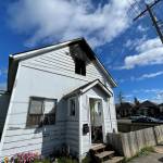 Michael S. Lockett / The Daily World 
Damage is visible following a house fire on Thursday morning near the main Aberdeen fire station.