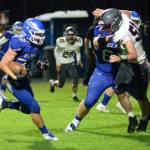 RYAN SPARKS | THE DAILY WORLD Elma running back Isaac Phillips runs for a touchdown during the a 33-30 loss to Hoquiam on Friday in Elma.