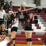 RYAN SPARKS | THE DAILY WORLD Ocosta senior Alexandria Matthews (18) and Montesanos Addie Winter (13) meet at net during the Bulldogs 3-0 win in a non-league match on Wednesday in Montesano.