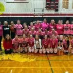 SUBMITTED PHOTO Ocosta and Raymond volleyball teams pose for a photo after the Ocosta Pink Night game to raise awareness for breast cancer on Thursday, Oct. 6, 2022 in Westport.