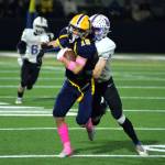 RYAN SPARKS | THE DAILY WORLD Aberdeen receiver Aidan Watkins (19) is tackled by Rochesters Ashton Rodriguez during the second half of Aberdeens 35-8 victory on Friday, Oct. 14, 2022 at Stewart Field in Aberdeen. Watkins caught two touchdown passes in the game.