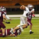 PHOTO BY BEN WINKELMAN 
Montesano running back Gabe Bodwell (44) is tackled by Hoquiams Zander Jump during the Bulldogs 47-6 victory on Friday at Olympic Stadium in Hoquiam.