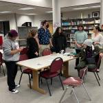 Andrea Mirante, furthest right, Director of After School Programs for the Ocosta School District, talks to the drone club prior to the Great ShakeOut, a statewide tsunami drill, on Oct. 20 (Michael S. Lockett / The Daily World)