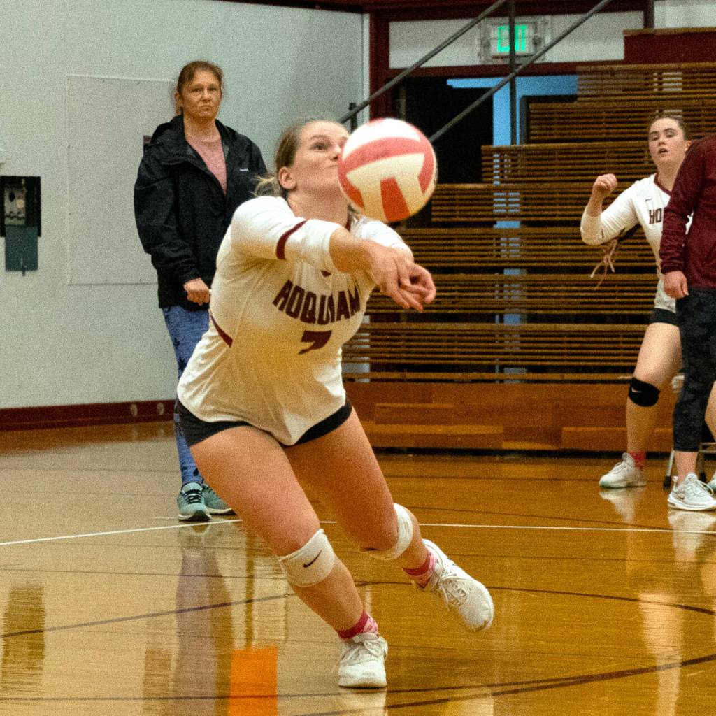 PHOTO BY PATTI REYNVAAN Hoquiams Ashlinn Cady digs the ball during the Grizzlies straight-set victory on Monday in Hoquiam.