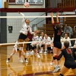 PHOTO BY PATTY REYNVAAN
Hoquiams Chloe Kennedy (5) smacks a kill while Raymonds Alia Enlow (10) defends during the Grizzlies straight-set victory on Monday in Hoquiam. Below, Hoquiams Ashlinn Cady digs the ball during the match.