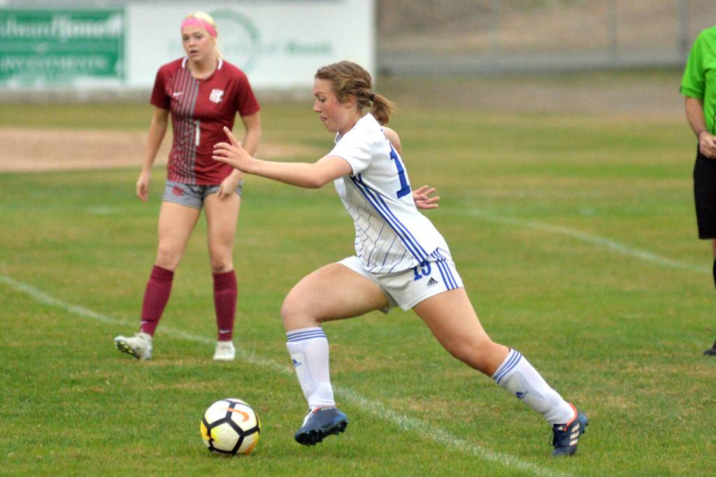 DAILY WORLD FILE PHOTO Elma senior Grace Spencer (19), seen here in a file photo, scored a hat trick in the Eagles 7-1 win over Eatonville on Senior Night Tuesday in Elma.