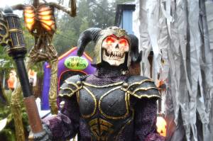 Matthew N. Wells / The Daily World
Grave Warrior, a skeleton soldier with an axe helps greet neighbors who wander along North 1st Street in Montesano on Tuesday afternoon. The animatronic character is part of the grand display that Kevin Farley, of Montesano, sets up in the front yard of his home, which sits at the intersection with West McBryde Avenue. Farley loves putting smiles on his neighbors faces. He cant wait to do the same thing at Christmastime.