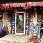 Matthew N. Wells / The Daily World
Dennis Bemis can be seen in the reflection of the front door to his home in the 1000 block of Fairway Drive in Central Park, which is also the location where ghouls, goblins, Jack-O-Lanterns and witches greet his family, friends and neighbors. While Bemis has had a tough year in 2022, describing the work and what went into getting he and his wife Michelles decorations set up seemed to lift his spirits during the late afternoon on Wednesday.