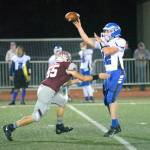 RYAN SPARKS | THE DAILY WORLD Elma quarterback Carter Studer (12) throws a pass while being hurried by Montesano linebacker Peyton Damasiewicz during Montesanos 62-0 win on Friday, Oct. 28, 2022 at Jack Rottle Field in Montesano.