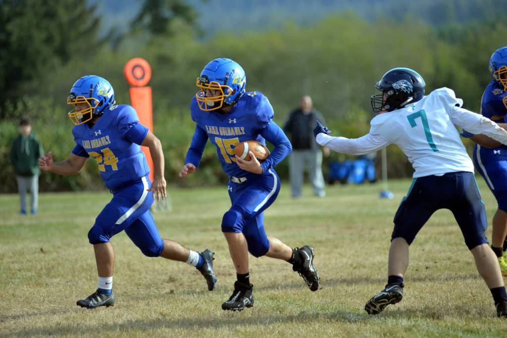 RYAN SPARKS | THE DAILY WORLD Lake Quinault running back Grady Fowler (15) breaks loose for a big gain during the Elks 67-38 win over Northwest Christian on Saturday, Oct. 29, 2022 at Lake Quinault High School.