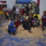 photos by Allen Leister / The Daily World 
Small groups of children from six to nine years old took turns rummaging through a large pile of hay to find candy, stickers, and snacks as fast as they could in the Halloween Scramble game during the Elma Fall Festival. Children ranging from three to five years old also got to play their own version of Halloween Scramble.