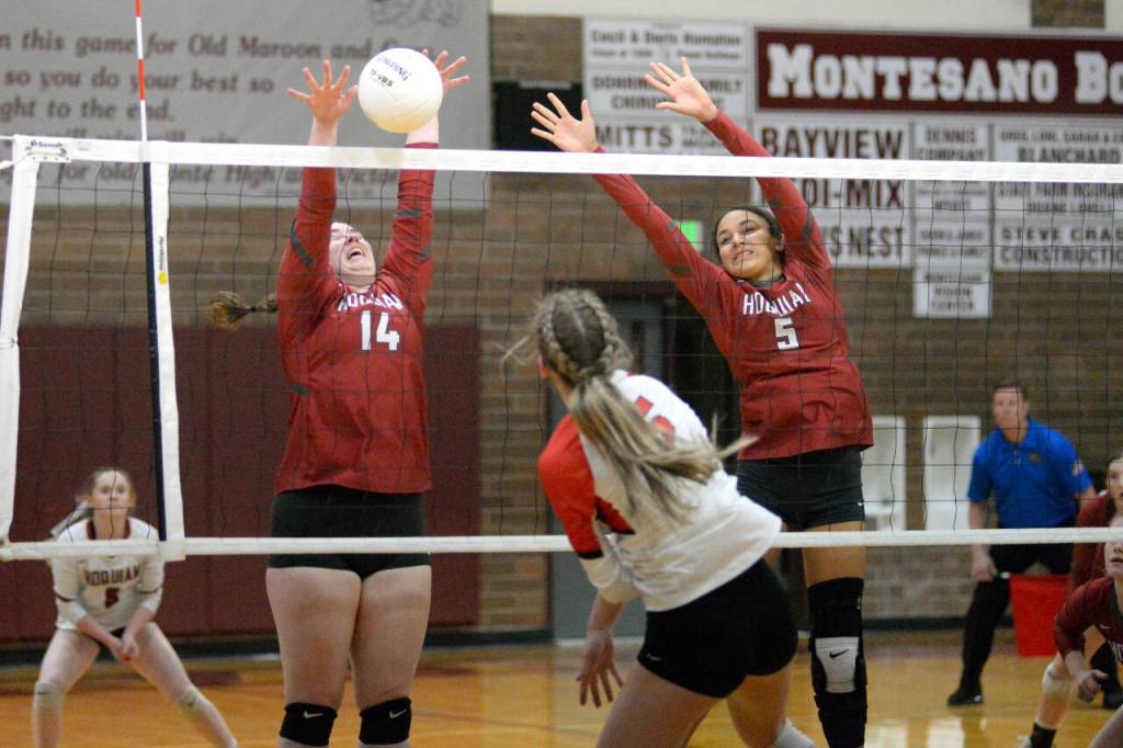 RYAN SPARKS | THE DAILY WORLD Hoquiams Jessie Dayton (14) and Chloe Kennedy (5) defend a shot by Castle Rocks Paige Kessler during the Grizzlies straight-set loss in a 1A District 4 Tournament semifinal game on Wednesday in Montesano.
