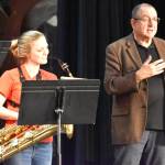 Kayden Scroggs, a Hoquiam High School junior who plays baritone saxophone, takes in the notes Michael Levine, founder of the Dallas Brass band, is giving her and her fellow students on Wednesday at Hoquiam High School. The students were there to learn from the band. Susan Peters, director of band and choir for Hoquiam High School, said it was a great day, for the students to learn from such an accomplished band. (Matthew N. Wells / The Daily World)