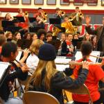 Michael Levine, founder of the Dallas Brass band, conducts during a rehearsal with Grays Harbor-area students  high school and middle school  Wednesday afternoon inside the Hoquiam High School gymnasium. Later in the evening, the band, and the students played a show to a packed house. (Matthew N. Wells / The Daily World)