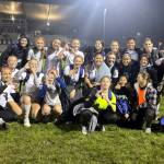 SUBMITTED PHOTO The Elma Eagles hold up an S for state after a 3-2 upset victory over La Center in a 1A District 4 Tournament semifinal game on Thursday, Nov. 3, 2022 at La Center High School. With the victory, the Eagles earn a berth in the district-title game and state playoffs.