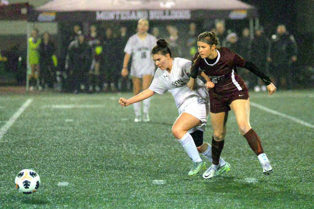 RYAN SPARKS | THE DAILY WORLD Montesanos Kennedy Campbell (9) competes with Seton Catholics Sofia Aragon during the Bulldogs 3-0 victory over Seton Catholic in a 1A District 4 Tournament semifinal game on Thursday, Nov. 3, 2022 in Montesano.