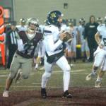 RYAN SPARKS / THE DAILY WORLD 
Montesano defensive lineman Tyler Johansen, left, chases Seton Catholic quarterback Kolten Gesser during the Bulldogs 47-7 win over Seton Catholic in a 1A district crossover game on Friday, Nov. 4, in Montesano.