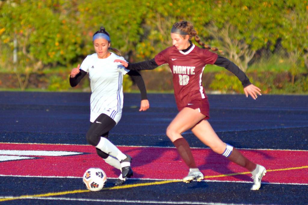 RYAN SPARKS / THE DAILY WORLD 
Montesano junior forward Mikayla Stanfield (10) moves the ball toward the Eagles net while Elmas Mia Monroe defends during the 1A District 4 Championship game on Saturday, Nov. 5, in Tenino.