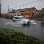 Clayton Franke / The Daily World
A car slogs through a swamped road on Friday, Nov. 4 on M Street in Aberdeen. Several inches of stormwater covered the road and spilled onto the sidewalk.