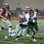RYAN SPARKS / THE DAILY WORLD
 Montesanos Kaleb Ames tackles Toppenish wide receiver Adrian Villanueva during the Bulldogs 24-22 state-tournament win over Toppenish on Friday in Montesano.