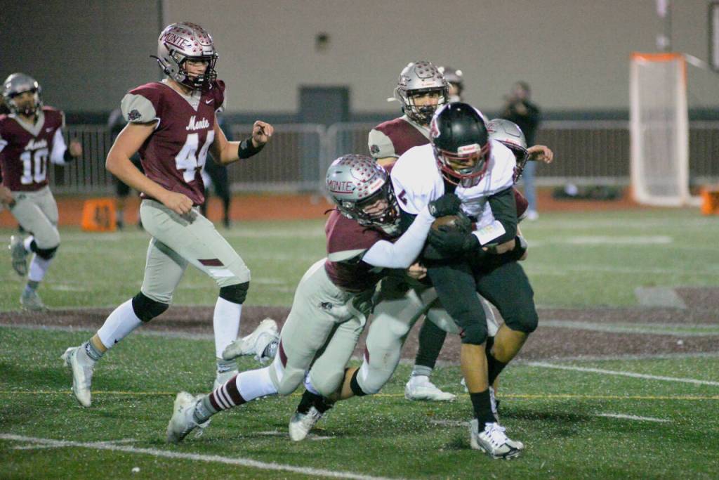 RYAN SPARKS / THE DAILY WORLD
 Montesanos Kaleb Ames tackles Toppenish wide receiver Adrian Villanueva during the Bulldogs 24-22 state-tournament win over Toppenish on Friday in Montesano.