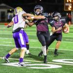 PHOTO BY LARRY BALE 
Raymond-South Bend running back Ferrill Johnson (10) looks for a hole while teammate Malachi Duckworth (54) throws a block during a 22-7 victory over Goldendale in the first round of the 2B State Football Tournament on Friday at Millam Field in South Bend.