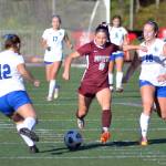 RYAN SPARKS / THE DAILY WORLD Montesano forward/midfielder Adda Potts (8) looks to shoot while being defended by Lakeside (Nine Mile Falls) defenders Jamie Katz (12) and Brooklyn More during the Bulldogs 1-0 victory on Saturday at Jack Rottle Field in Montesano.