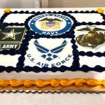 The logos from four of the armed forces of the United States (in clockwise order)  the U.S. Army, U.S. Navy, U.S. Marine Corps and the U.S. Air Force  are shown on a sweet sheet cake that was served on Thursday night to veterans and their families at the Aberdeen Elks Lodge 593. (Matthew N. Wells / The Daily World)