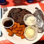 Aberdeen Elks Lodge 593 staff helps military veterans honor Veterans Day with a hearty feast full of delicious prime rib, a near-sizzling baked potato and cooked carrots. In addition to the meal, the veterans and their adult family and friends also were able to enjoy a few cold beers, wine and cocktails. (Matthew N. Wells / The Daily World)