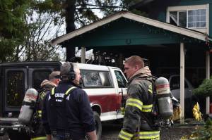 Clayton Franke / The Daily World
Firefighters attend the scene of a fire in South Aberdeen that began in an RV on Thursday, Nov. 10.