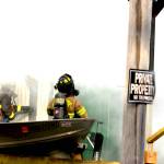 Firefighters peer through heavy smoke at a structure fire in Elma on Nov. 15. (Michael S. Lockett / The Daily World)