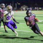 PHOTO BY LARRY BALE 
Raymond-South Bend running back Ferrill Johnson (10) turns the corner during a 54-0 win over Adna in the 2B State playoffs last week. The Ravens will face league-rival Pe Ell-Willapa Valley in the state quarterfinals on Friday in Montesano.