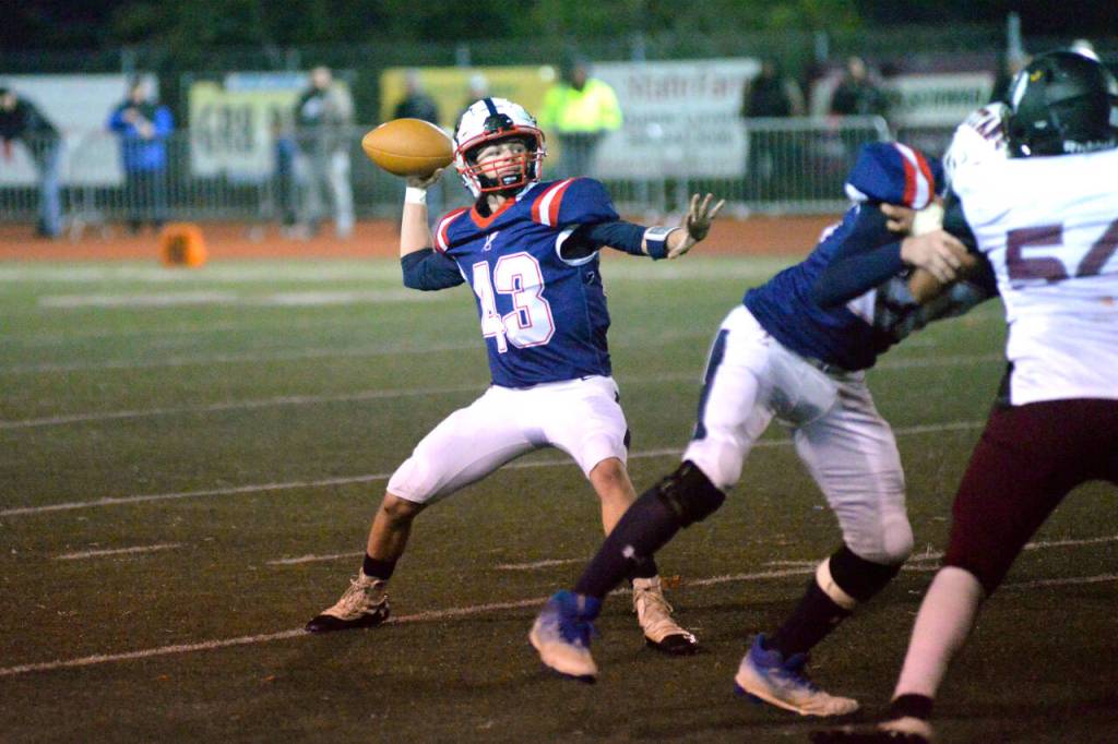 RYAN SPARKS | THE DAILY WORLD Pe Ell-Willapa Valley quarterback Kolten Fluke drops back to pass during the Titans 34-13 win over Raymond-South Bend in a 2B State quarterfinal game on Friday in Montesano.