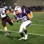 PHOTO BY LARRY BALE 
Pe Ell-Willapa Valley running back Blake Howard (32), seen here in a state-quarterfinal win over Raymond-South Bend last week, will lead the Titans against No. 2 Okanogan in the state semifinals on Saturday in Wenatchee.