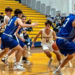PHOTO BY FOREST WORGUM 
Aberdeens Giovanni Ambrogiani (21) drives against the Elma defense in the Bobcats 71-49 loss on Monday in Aberdeen.