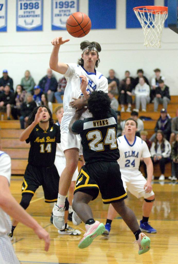 RYAN SPARKS | THE DAILY WORLD Elmas Gibson Cain, top, blocks the shot of North Beachs Tyrell Curry-Sith (24) during the Eagles 65-24 victory on Wednesday, Nov. 30, 2022 at Elma High School.